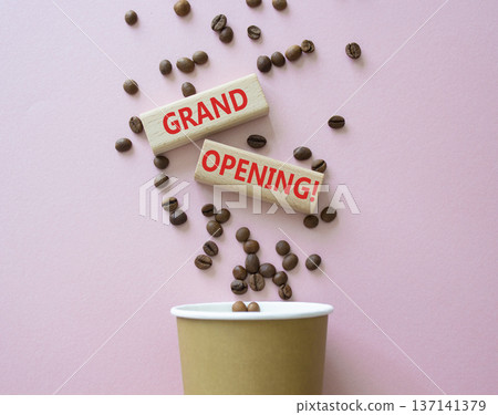 Grand Opening symbol. Concept word Grand Opening on wooden blocks. Beautiful pink background with coffee cup. Business and Grand Opening concept. Copy space Grand Opening symbol. Concept word Grand Opening on wooden blocks. Beautiful pink background with coffee cup. Business and Grand Opening concept. Copy space 137141379
