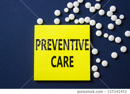 Preventive Care symbol. Concept word Preventive Care on yellow note. Beautiful deep blue background with pills. Medicine and Preventive Care concept. Copy space 137141452