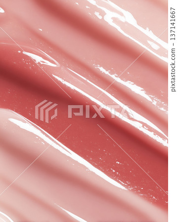 Glossy pink cosmetic smear shown in close macro style on a neutral backdrop, beauty product swatch and skincare concept Glossy pink cosmetic smear shown in close macro style on a neutral backdrop, beauty product swatch and skincare concept 137141667