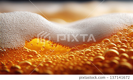 Closeup view of curved beer foam and golden bubbles on warm blurred background, expressing freshness concept Closeup view of curved beer foam and golden bubbles on warm blurred background, expressing freshness concept 137141672