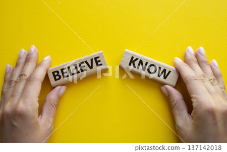 Believe or Know symbol. Concept word Believe or Know on wooden blocks. Businessman hand. Beautiful yellow background. Business and Believe or Know concept. Copy space Believe or Know symbol. Concept word Believe or Know on wooden blocks. Businessman hand. Beautiful yellow background. Business and Believe or Know concept. Copy space 137142018