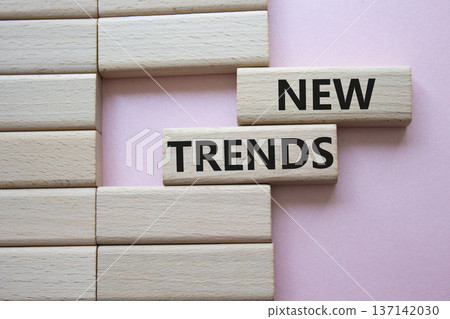 New Trends symbol. Wooden blocks with words New Trends. Beautiful pink background. Business and New Trends concept. Copy space. New Trends symbol. Wooden blocks with words New Trends. Beautiful pink background. Business and New Trends concept. Copy space. 137142030