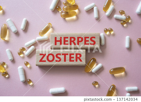 Herpes Zoster symbol. Concept word Herpes Zoster on wooden blocks. Beautiful pink background with pills. Medicine and Herpes Zoster concept. Copy space Herpes Zoster symbol. Concept word Herpes Zoster on wooden blocks. Beautiful pink background with pills. Medicine and Herpes Zoster concept. Copy space 137142034