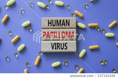 Human Papilloma Virus symbol. Concept word Human Papilloma Virus on wooden blocks. Beautiful purple background with pills. Medicine and Human Papilloma Virus concept. Copy space Human Papilloma Virus symbol. Concept word Human Papilloma Virus on wooden blocks. Beautiful purple background with pills. Medicine and Human Papilloma Virus concept. Copy space 137142200