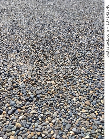 The pebbled ground of the temple parking lot The pebbled ground of the temple parking lot 137142546