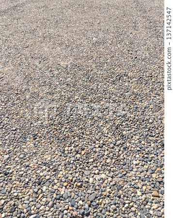 The pebbled ground of the temple parking lot The pebbled ground of the temple parking lot 137142547