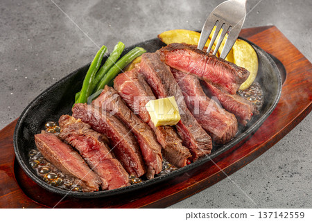 Domestic beef steak served on a hot plate Domestic beef steak served on a hot plate 137142559