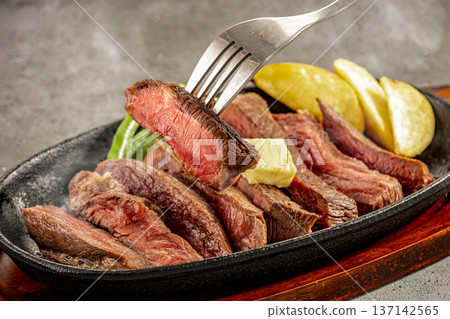 Domestic beef steak served on a hot plate 137142565
