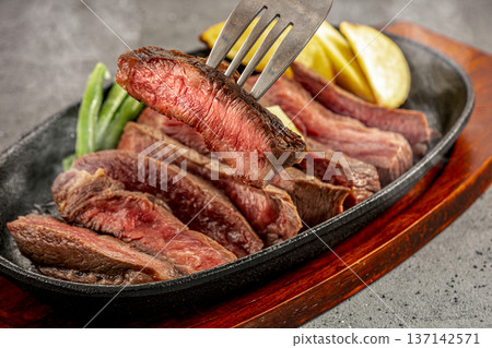 Domestic beef steak served on a hot plate 137142571