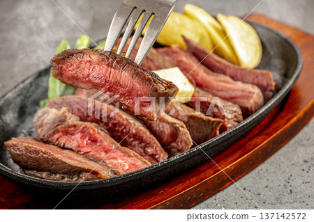 Domestic beef steak served on a hot plate Domestic beef steak served on a hot plate 137142572