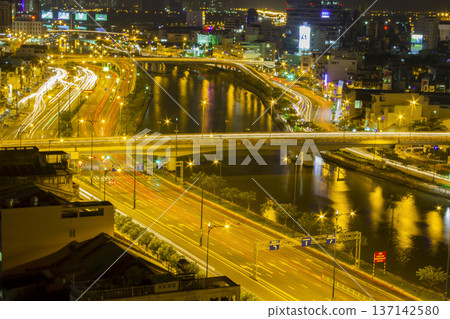 Aerial View Of Vo Van Kiet Avenue And Tau Hu Canal In Ho Chi Minh City At Night, Vietnam. Aerial View Of Vo Van Kiet Avenue And Tau Hu Canal In Ho Chi Minh City At Night, Vietnam. 137142580
