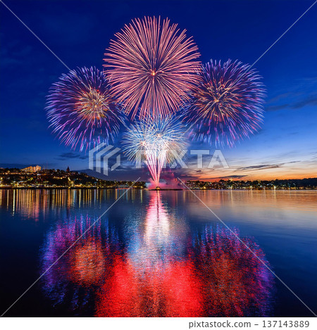 Vibrant Fireworks Lighting Up City Skyline 137143889