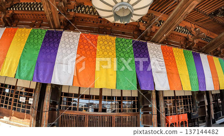 The vibrant five-colored curtains and traditional architecture of the main hall of Gokokuji Temple The vibrant five-colored curtains and traditional architecture of the main hall of Gokokuji Temple 137144482