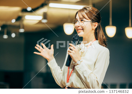 A woman giving a presentation A woman giving a presentation 137146832