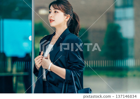 Young woman in a suit 137146834