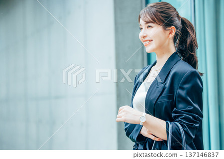Young woman in a suit Young woman in a suit 137146837