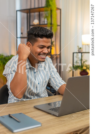 Indian man says wow as laptop alert shows prize news celebrates win feels proud of finished project Indian man says wow as laptop alert shows prize news celebrates win feels proud of finished project 137147267