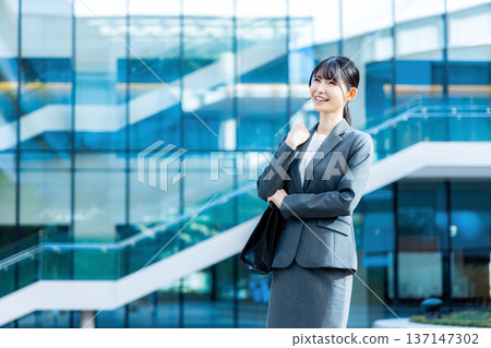 business woman wearing a suit business woman wearing a suit 137147302