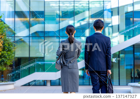 Businessman walking in the office town Businessman walking in the office town 137147327