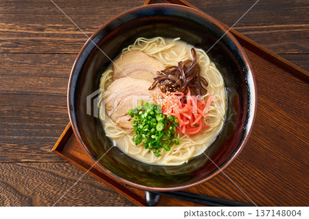 Pork bone ramen topped with roasted pork and pickled ginger Pork bone ramen topped with roasted pork and pickled ginger 137148004