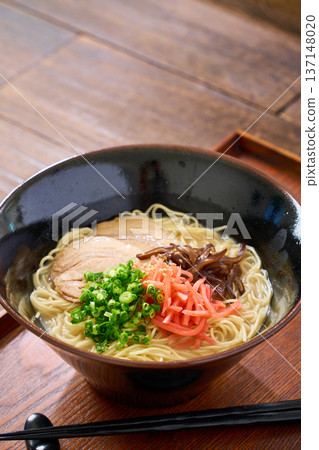 Pork bone ramen topped with roasted pork and pickled ginger Pork bone ramen topped with roasted pork and pickled ginger 137148020