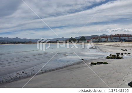 Ladeira Beach in Baiona under a sky of soft clouds reflecting the natural light of March in Galicia Ladeira Beach in Baiona under a sky of soft clouds reflecting the natural light of March in Galicia 137148305