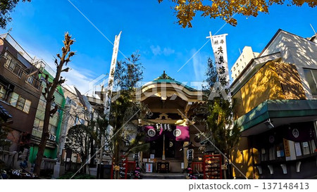 Inari Shrine and golden ginkgo trees on a clear autumn day 137148413