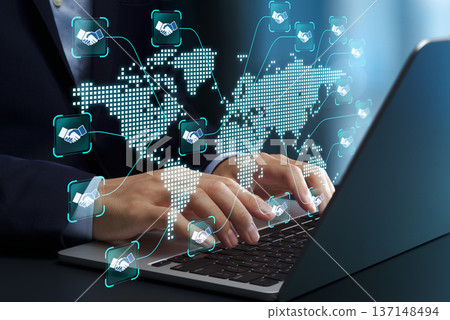 Global business partnerships and cross border trade. International business strategies. Worldwide collaboration using laptops. 137148494