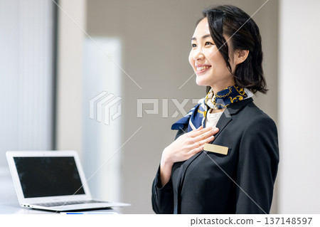 Woman at reception Woman at reception 137148597