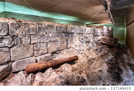 View of the excavated stone walls and rusty cannons of the historic Castillo de San Cristobal ruins located in an underground museum in Santa Cruz de Tenerife, Canary Islands 137149433