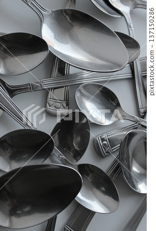 Tablespoons And Teaspoons Chaotically Scattered Vertical Stock Photo 137150286
