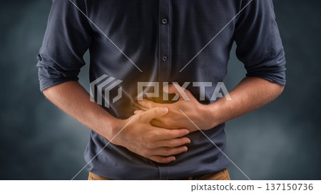 Man clutching stomach in pain gesture 137150736
