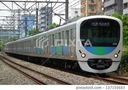 Seibu Shinjuku Line 30000 series running between Takadanobaba and Shimo-Ochiai Seibu Shinjuku Line 30000 series running between Takadanobaba and Shimo-Ochiai 137150883