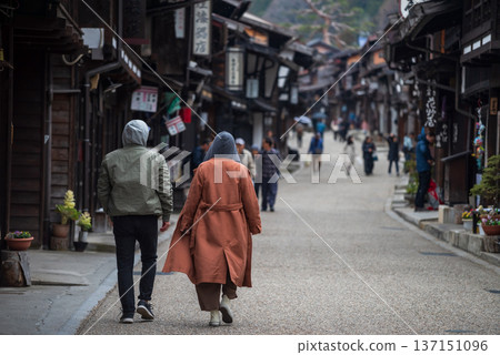 Japanese couple visit Narai juku preserved post town, Nagano Japanese couple visit Narai juku preserved post town, Nagano 137151096