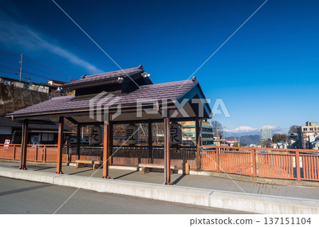Shibu Onsen hot springs town bus stop with central alps, Nagano Shibu Onsen hot springs town bus stop with central alps, Nagano 137151104