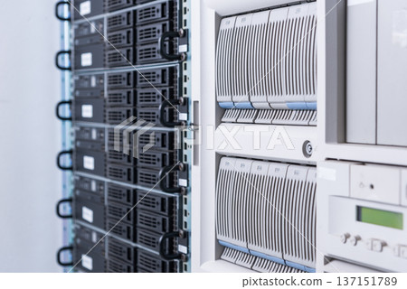 Cluster of data storage hard drives inside server room Cluster of data storage hard drives inside server room 137151789