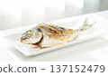 Grilled red sea bream with tail and head on a plate on a white background 137152479