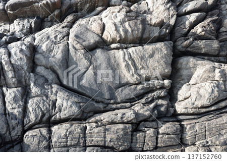 Vintage stone wall background, texture in natural grey colors. Vintage stone wall background, texture in natural grey colors. 137152760
