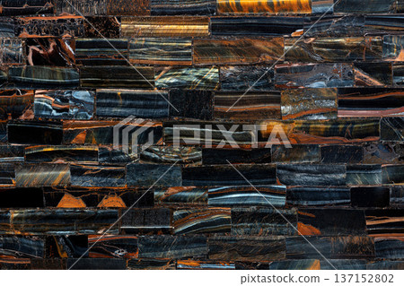 Tiger Eye Blue slab. Semiprecious stone for ceramic wall and floor digital tiles. Exclusive luxury gemstone background, texture. Matt natural semi precious mineral pattern. luxury gemstone background. 137152802