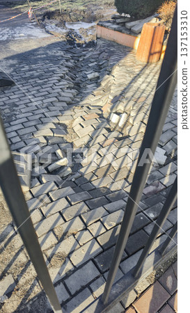 Road barrier covering collapsed asphalt Road repair work Danger zone in the park Road barrier covering collapsed asphalt Road repair work Danger zone in the park 137153310