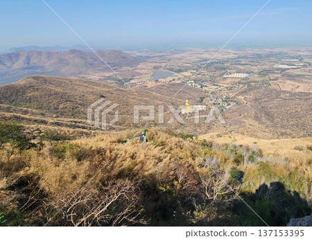 Panoramic View of Large Golden Buddha Statue on Mountain Peak in Thailand 137153395