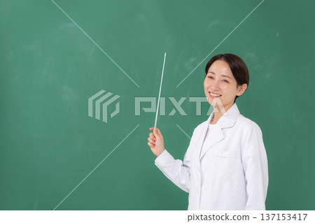 A woman in a white coat 137153417