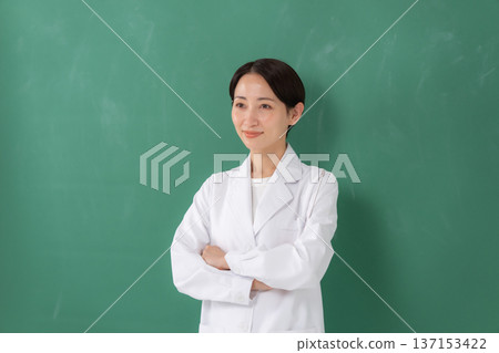 A woman in a white coat A woman in a white coat 137153422