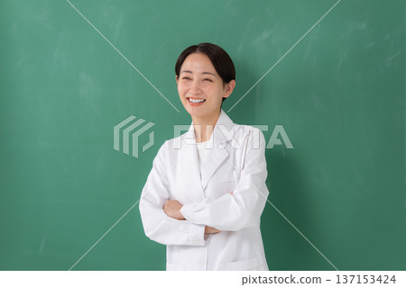 A woman in a white coat A woman in a white coat 137153424