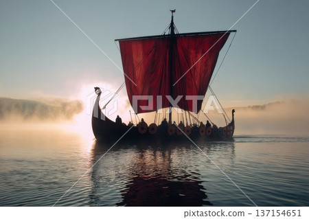 Viking longship with red sail glides across calm sea at sunrise, capturing epic maritime voyage, Scandinavian history and exploration spirit 137154651