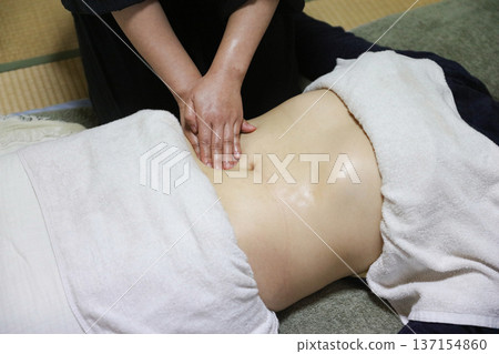 Woman doing oil massage Woman doing oil massage 137154860
