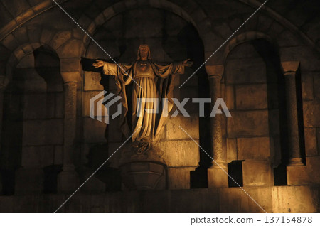 religious image pierced by a ray of light religious image pierced by a ray of light 137154878