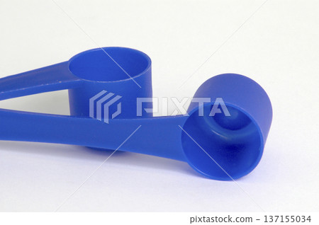 blue plastic teaspoons on white background blue plastic teaspoons on white background 137155034