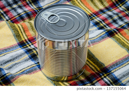 Unlabeled can of food against a colorful background 137155064