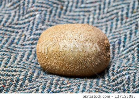 kiwi placed on a wool-textured background kiwi placed on a wool-textured background 137155083